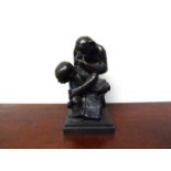 A resin bronze sculpture depicting monkey pondering with skull, Darwin's Theory,