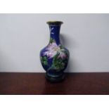 A 20th Century cloisonné vase, deep blue ground decorated with foliage and flowers,