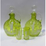 Two Victorian Mary Gregory lime green glass jug decanters and glasses (4)