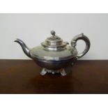 A Victorian silver teapot, the knop with foliate design, scroll handle, London 1839,