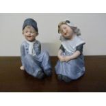 Two Dutch ceramic Piano figurines boy and girl,