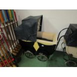 A 1940's/50's dolls pram with canopy