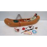 A Marx Toys Indian with accessories in plastic canoe