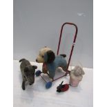 A selection of stuffed vintage animals including Schuco wind-up dog,