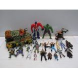 A box of mixed toy figures including Teenage Mutant Ninja Turtles, Power Rangers,