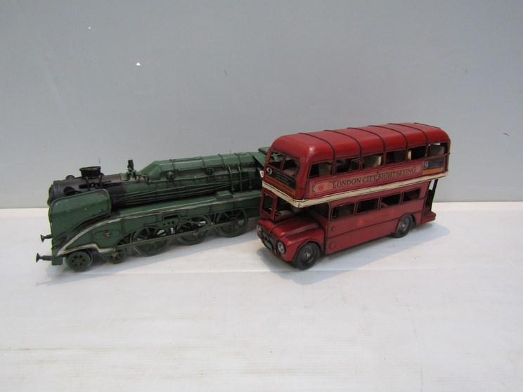 A large tinplate London bus and 4-6-2 railway locomotive