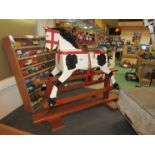 A 'Leeway' wooden rocking horse on trestle base