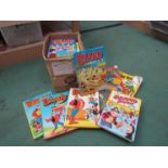 A box of mixed annuals including Beano and Dandy