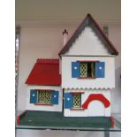 A wooden construction colourful dolls house