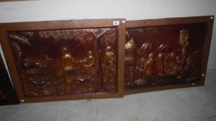 A pair of large copper wall plaques depicting central African scenes,