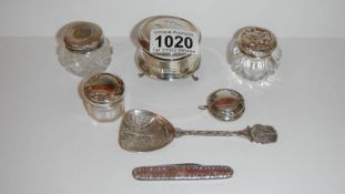A collection of silver topped pots etc