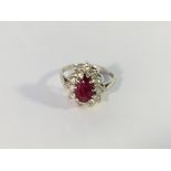 A 14k white gold pear shaped ruby and diamond ring,