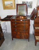 A Georgian mahogany gentleman's dressing chest with copper bowls