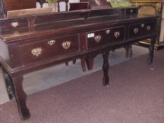 An early 18th Century oak dresser base with 3 large drawers plus 2 small shelf drawers.