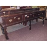 An early 18th Century oak dresser base with 3 large drawers plus 2 small shelf drawers.