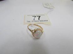 A large opal 9ct gold ring,