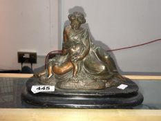A spelter figure group of mother and child