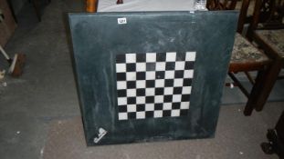 A very heavy chequered marble table top