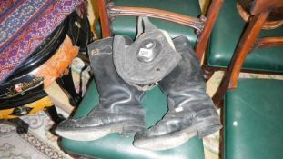 A pair of WW2 flying boots and a flying hat