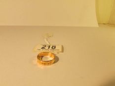 A 22ct gold wedding band,