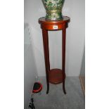 A mahogany inlaid torchere