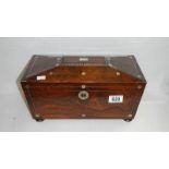 A mahogany tea caddy