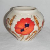 A Moorcroft 'Harvest Poppy' vase designed by Emma Bossons