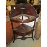 A Georgian mahogany corner wash stand