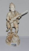 A 19th century large ivory figure of a poacher