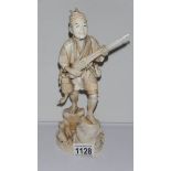 A 19th century large ivory figure of a poacher