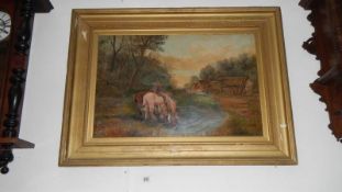 A large gilt framed oil on canvas of horses drinking in pond