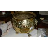 A Victorian brass jardiniere on 3 paw feet