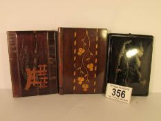 2 oriental style card cases and one other