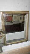 A large gilt framed mirror