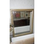 A large gilt framed mirror