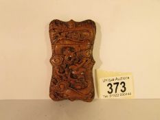 An oriental carved wood card case, 8 x 4.
