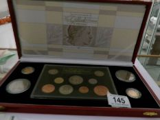 A Royal Mint Queen Elizabeth II Gillick portrait collection of 13 proof coins including sovereign