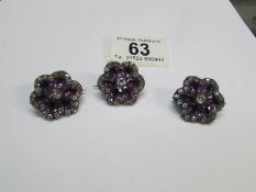 3 gem set white metal brooches