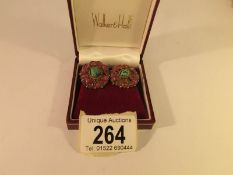 A pair of mid 20th century foiled back ruby and turquoise ear clips