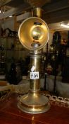 An old brass ship's candle lamp