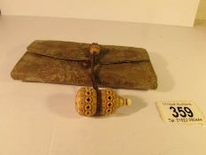 A 19th century silk purse with ivory toggle