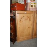 A single door pine cupboard