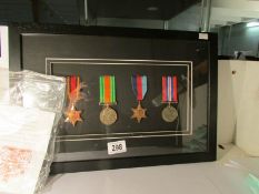 A framed set of WW2 medals (Burma star, 1939-45 star,