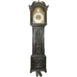 A carved oak brass faced Grandfather clock in working order