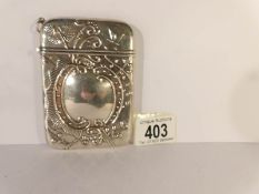A silver card case marked 925,