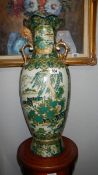 A large hand decorated oriental vase