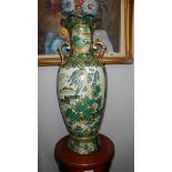 A large hand decorated oriental vase
