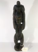 A West African female ancestor fertility statue from the Cote D'Ivoire and the Southern Regions of