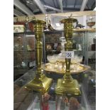A pair of Victorian brass candlesticks