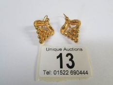 A pair of 18ct gold pendant earrings